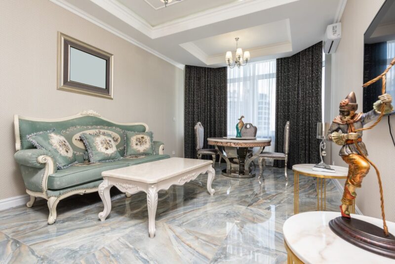 living room interior with furniture and statuettes in flat